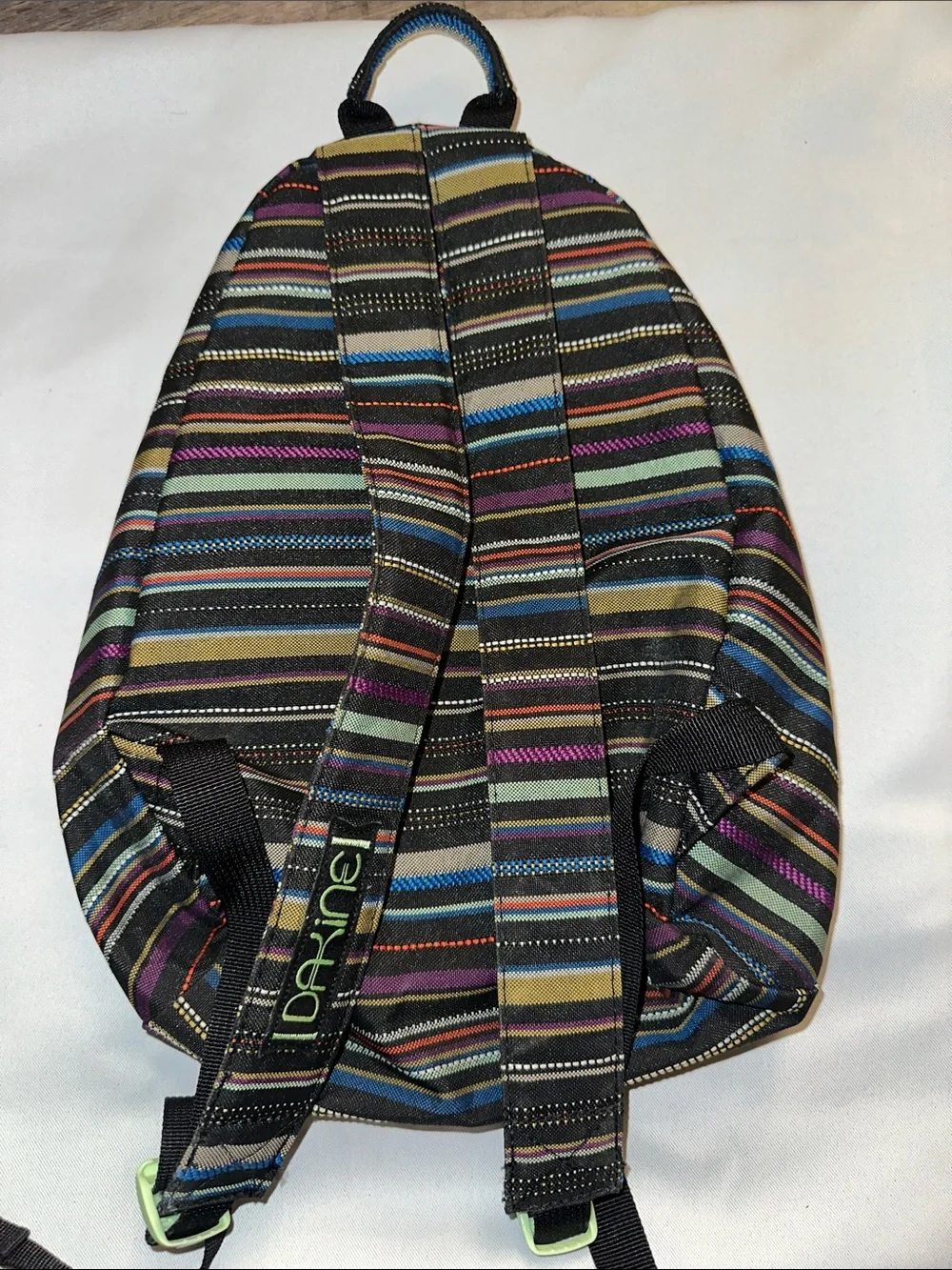 Dakine women’s Striped Backpack in Black, Blue, Purple, Green
